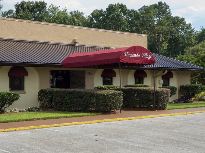 View of the Hacienda Village Clubhouse and parking lot